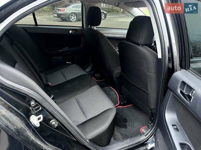 Черный Мицубиси Лансер, объемом двигателя 2 л и пробегом 217 тыс. км за 7000 $, фото 45 на Automoto.ua