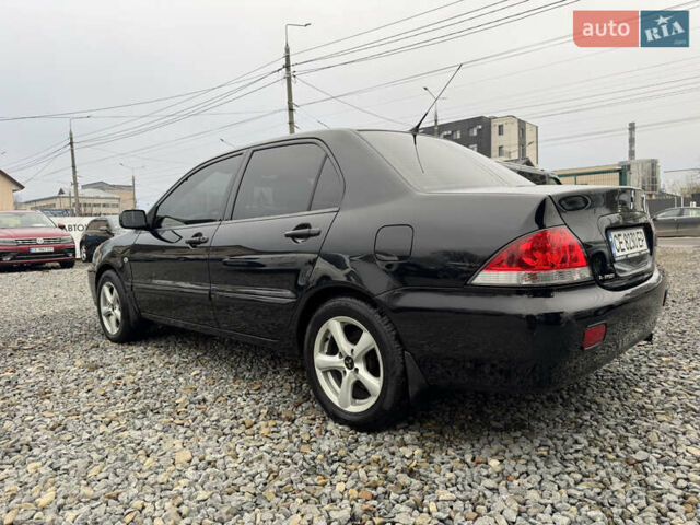 Черный Мицубиси Лансер, объемом двигателя 1.58 л и пробегом 202 тыс. км за 4100 $, фото 15 на Automoto.ua