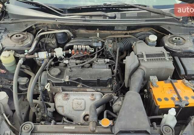 Черный Мицубиси Лансер, объемом двигателя 1.6 л и пробегом 243 тыс. км за 4500 $, фото 19 на Automoto.ua