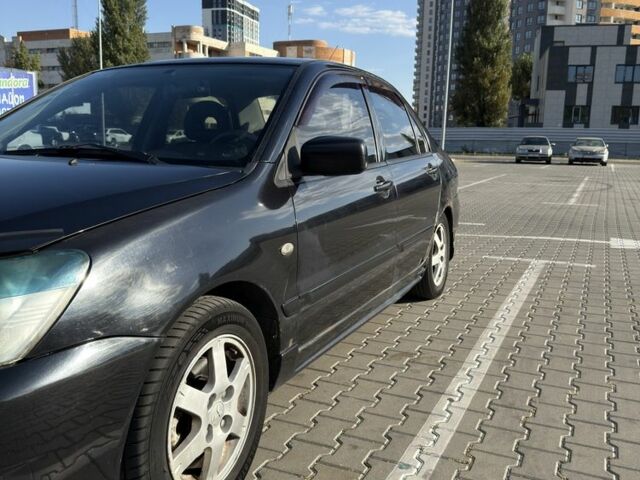 Чорний Міцубісі Lancer, об'ємом двигуна 1.6 л та пробігом 364 тис. км за 3000 $, фото 4 на Automoto.ua