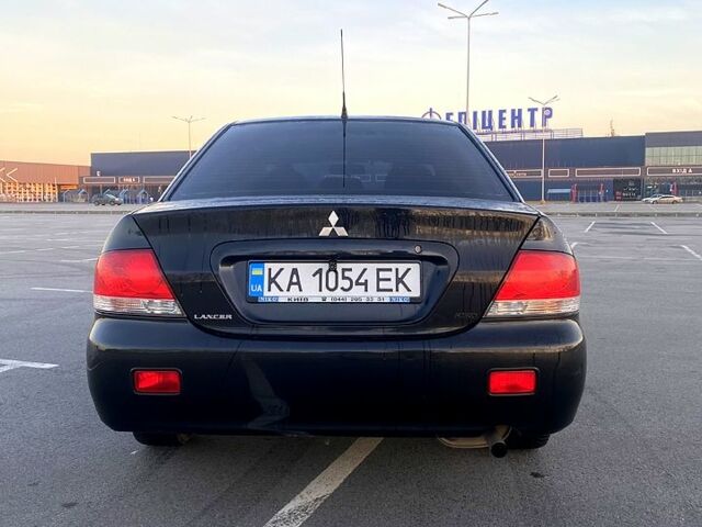 Черный Мицубиси Лансер, объемом двигателя 1.6 л и пробегом 375 тыс. км за 4899 $, фото 4 на Automoto.ua