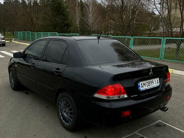 Чорний Міцубісі Lancer, об'ємом двигуна 1.6 л та пробігом 380 тис. км за 4350 $, фото 5 на Automoto.ua