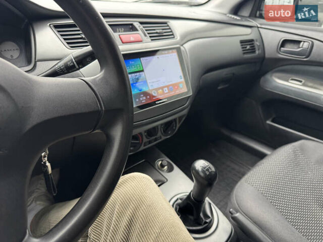 Черный Мицубиси Лансер, объемом двигателя 1.58 л и пробегом 202 тыс. км за 4100 $, фото 7 на Automoto.ua