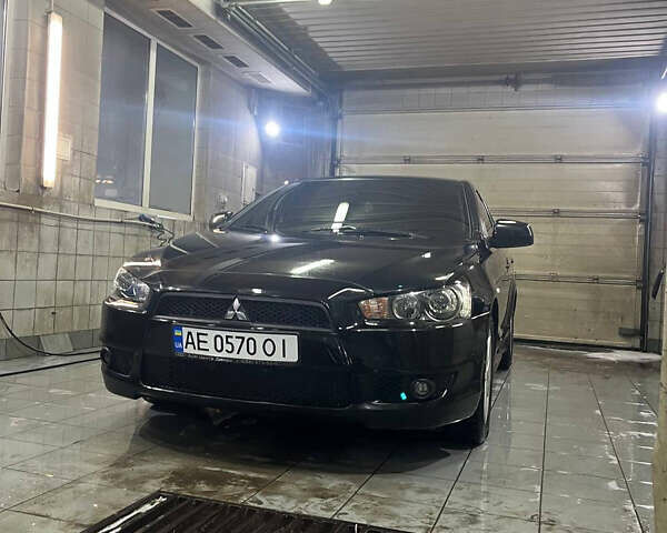 Черный Мицубиси Лансер, объемом двигателя 2 л и пробегом 200 тыс. км за 8000 $, фото 2 на Automoto.ua