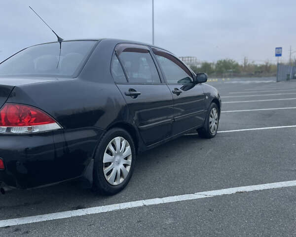 Міцубісі Lancer 2008 у Києві на Automoto.ua Чорний Міцубісі Lancer, об'ємом двигуна 1.58 л та пробігом 300 тис. км за 3800 $, фото 2 на Automoto.ua