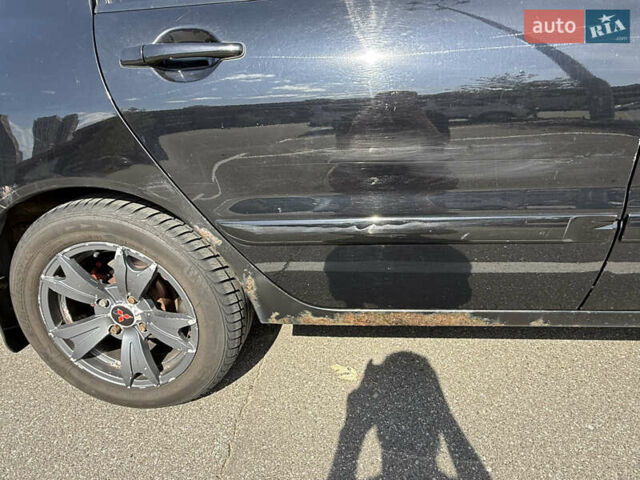 Черный Мицубиси Лансер, объемом двигателя 1.6 л и пробегом 321 тыс. км за 5000 $, фото 11 на Automoto.ua