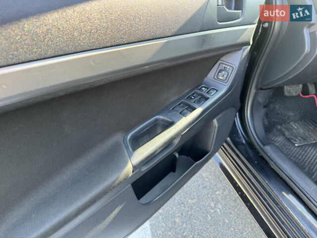 Чорний Міцубісі Lancer, об'ємом двигуна 2 л та пробігом 286 тис. км за 6450 $, фото 15 на Automoto.ua