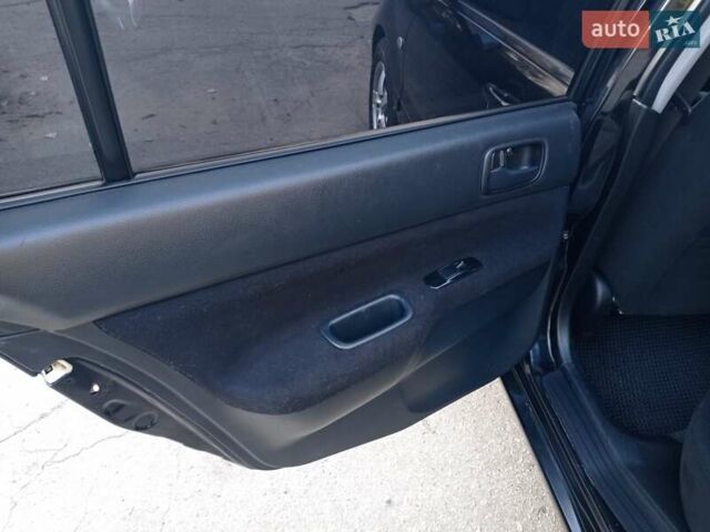 Чорний Міцубісі Lancer, об'ємом двигуна 1.58 л та пробігом 286 тис. км за 4950 $, фото 11 на Automoto.ua