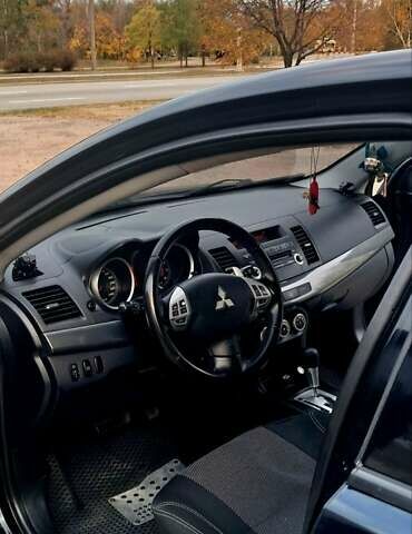 Черный Мицубиси Лансер, объемом двигателя 2 л и пробегом 211 тыс. км за 6900 $, фото 8 на Automoto.ua