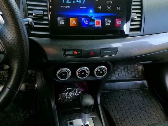 Черный Мицубиси Лансер, объемом двигателя 2 л и пробегом 196 тыс. км за 5500 $, фото 13 на Automoto.ua