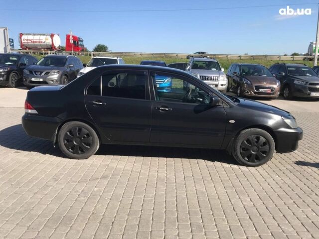 Чорний Міцубісі Lancer, об'ємом двигуна 1.6 л та пробігом 356 тис. км за 4590 $, фото 9 на Automoto.ua