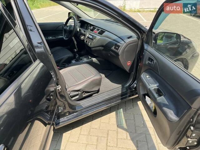 Чорний Міцубісі Lancer, об'ємом двигуна 1.6 л та пробігом 296 тис. км за 4200 $, фото 43 на Automoto.ua