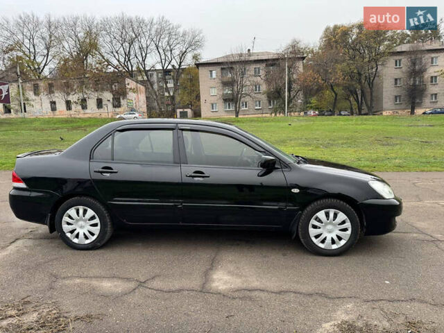 Чорний Міцубісі Lancer, об'ємом двигуна 1.6 л та пробігом 200 тис. км за 4500 $, фото 4 на Automoto.ua