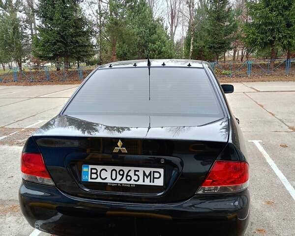 Мицубиси Лансер 2008 в Львове на Automoto.ua Черный Мицубиси Лансер, объемом двигателя 1.58 л и пробегом 200 тыс. км за 5200 $, фото 57 на Automoto.ua