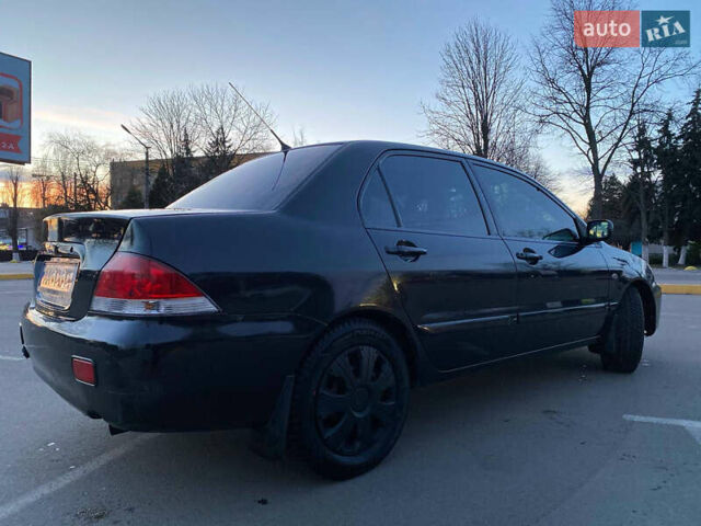 Чорний Міцубісі Lancer, об'ємом двигуна 1.58 л та пробігом 327 тис. км за 4000 $, фото 5 на Automoto.ua