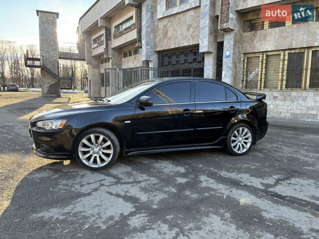 Черный Мицубиси Лансер, объемом двигателя 2 л и пробегом 236 тыс. км за 6450 $, фото 1 на Automoto.ua