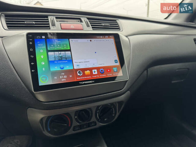 Черный Мицубиси Лансер, объемом двигателя 1.58 л и пробегом 202 тыс. км за 4100 $, фото 6 на Automoto.ua