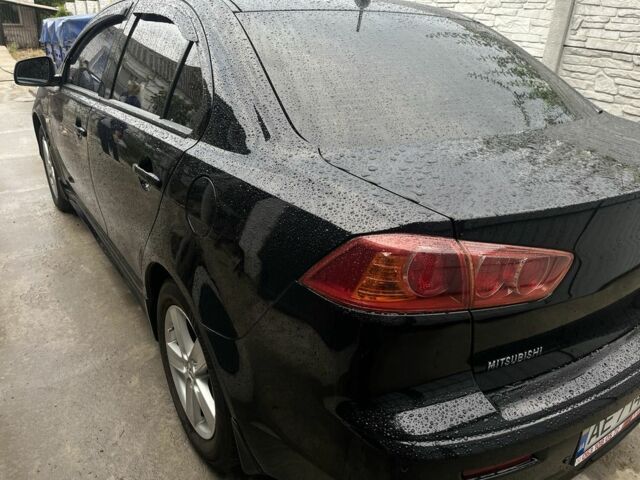 Чорний Міцубісі Lancer, об'ємом двигуна 2 л та пробігом 219 тис. км за 6800 $, фото 5 на Automoto.ua