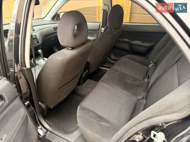 Чорний Міцубісі Lancer, об'ємом двигуна 1.6 л та пробігом 265 тис. км за 4700 $, фото 22 на Automoto.ua