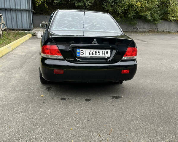 Чорний Міцубісі Lancer, об'ємом двигуна 1.58 л та пробігом 192 тис. км за 4500 $, фото 3 на Automoto.ua