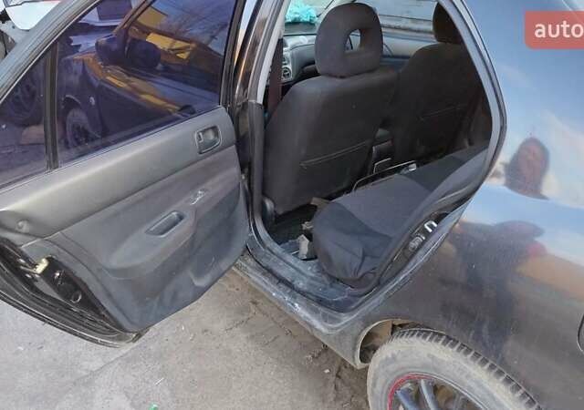 Черный Мицубиси Лансер, объемом двигателя 1.6 л и пробегом 200 тыс. км за 2000 $, фото 10 на Automoto.ua