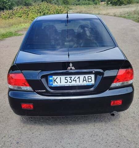 Черный Мицубиси Лансер, объемом двигателя 1.6 л и пробегом 243 тыс. км за 4500 $, фото 2 на Automoto.ua
