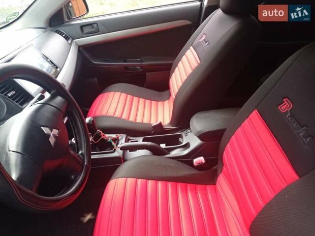 Черный Мицубиси Лансер, объемом двигателя 1.5 л и пробегом 123 тыс. км за 7000 $, фото 18 на Automoto.ua