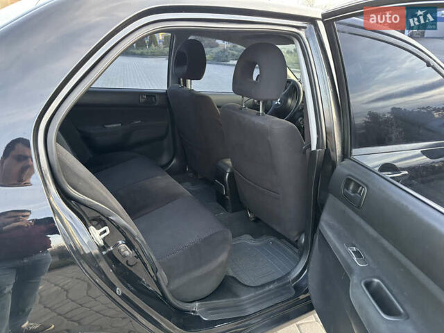 Чорний Міцубісі Lancer, об'ємом двигуна 1.58 л та пробігом 344 тис. км за 3999 $, фото 8 на Automoto.ua