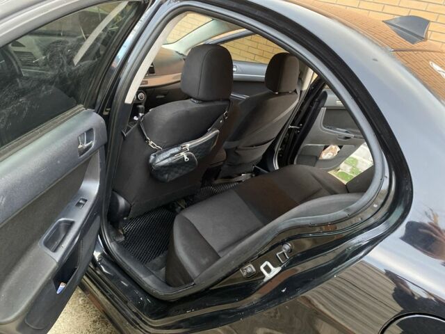 Черный Мицубиси Лансер, объемом двигателя 2 л и пробегом 140 тыс. км за 7200 $, фото 5 на Automoto.ua