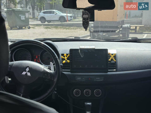 Черный Мицубиси Лансер, объемом двигателя 2 л и пробегом 295 тыс. км за 7000 $, фото 7 на Automoto.ua