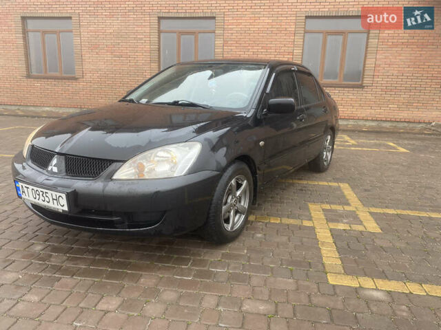 Черный Мицубиси Лансер, объемом двигателя 1.58 л и пробегом 211 тыс. км за 6333 $, фото 11 на Automoto.ua