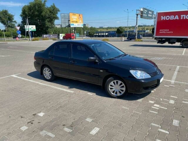 Чорний Міцубісі Lancer, об'ємом двигуна 1.6 л та пробігом 229 тис. км за 4200 $, фото 1 на Automoto.ua