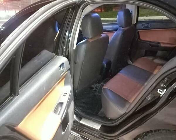 Черный Мицубиси Лансер, объемом двигателя 2 л и пробегом 240 тыс. км за 6400 $, фото 9 на Automoto.ua