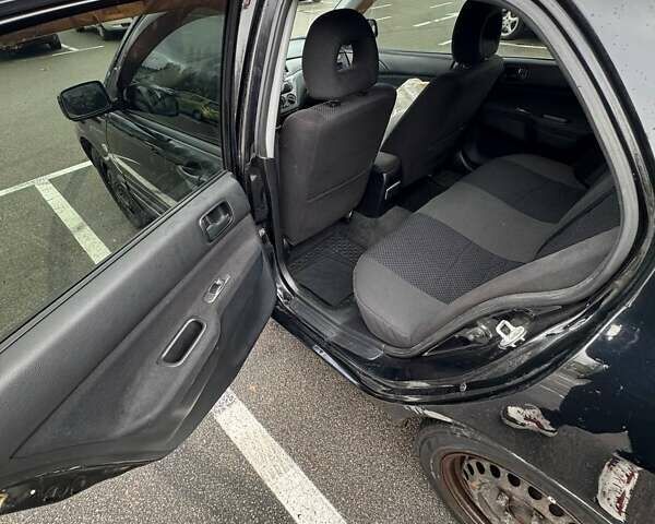 Чорний Міцубісі Lancer, об'ємом двигуна 1.6 л та пробігом 245 тис. км за 4500 $, фото 17 на Automoto.ua