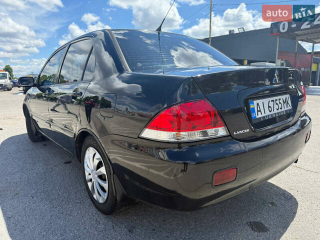 Чорний Міцубісі Lancer, об'ємом двигуна 1.6 л та пробігом 292 тис. км за 3600 $, фото 2 на Automoto.ua