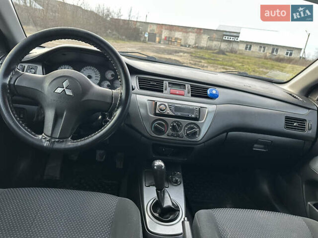 Черный Мицубиси Лансер, объемом двигателя 1.58 л и пробегом 312 тыс. км за 4900 $, фото 8 на Automoto.ua