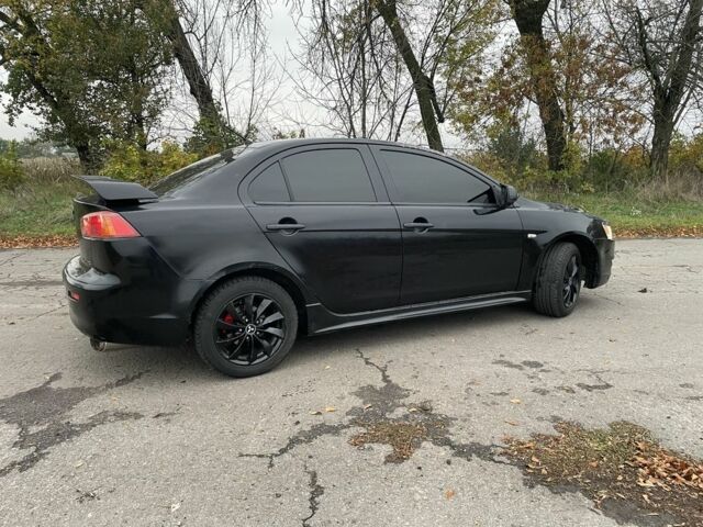 Чорний Міцубісі Lancer, об'ємом двигуна 2 л та пробігом 400 тис. км за 4396 $, фото 6 на Automoto.ua