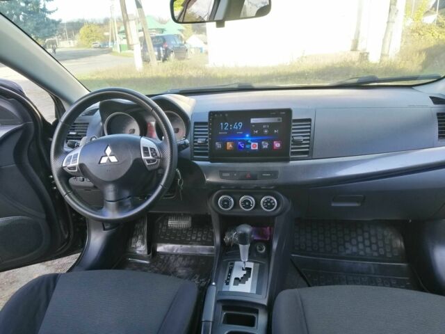 Міцубісі Lancer 2008 у Києві на Automoto.ua Чорний Міцубісі Lancer, об'ємом двигуна 2 л та пробігом 196 тис. км за 5500 $, фото 19 на Automoto.ua