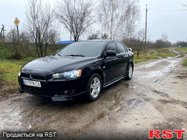 Черный Мицубиси Лансер, объемом двигателя 2 л и пробегом 226 тыс. км за 6600 $, фото 4 на Automoto.ua