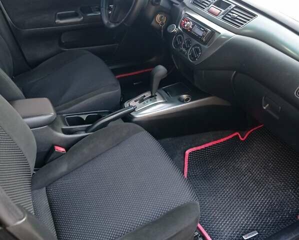 Чорний Міцубісі Lancer, об'ємом двигуна 1.58 л та пробігом 286 тис. км за 4950 $, фото 17 на Automoto.ua
