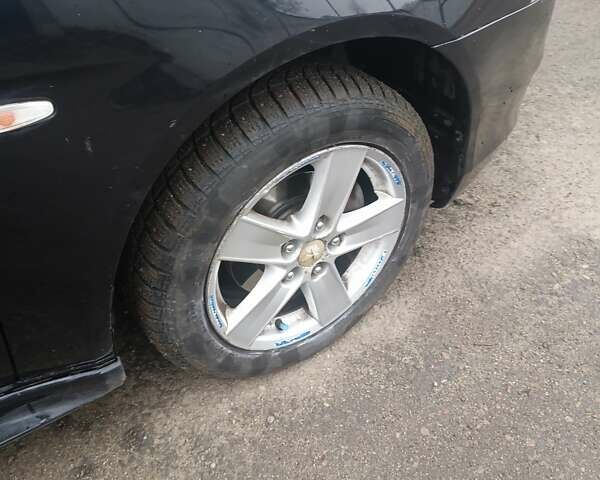 Черный Мицубиси Лансер, объемом двигателя 2 л и пробегом 192 тыс. км за 6350 $, фото 4 на Automoto.ua