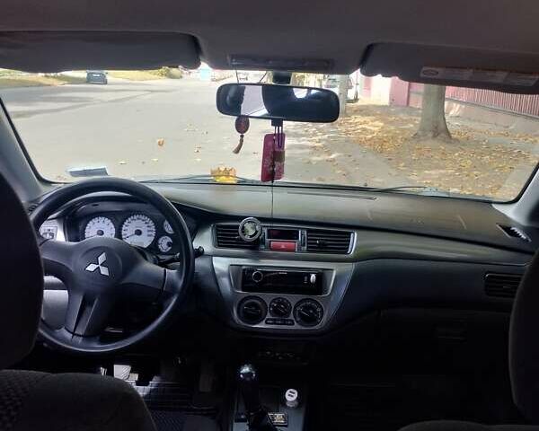 Чорний Міцубісі Lancer, об'ємом двигуна 1.58 л та пробігом 323 тис. км за 4500 $, фото 2 на Automoto.ua