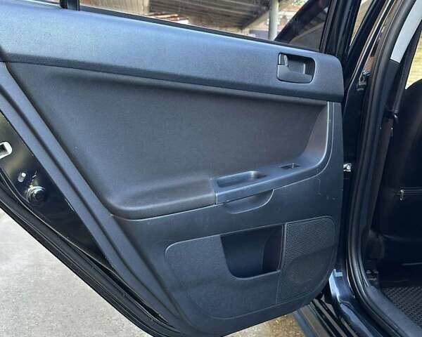 Черный Мицубиси Лансер, объемом двигателя 2 л и пробегом 230 тыс. км за 7000 $, фото 7 на Automoto.ua