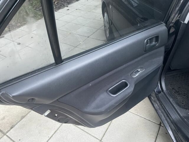 Черный Мицубиси Лансер, объемом двигателя 1.6 л и пробегом 226 тыс. км за 3750 $, фото 12 на Automoto.ua