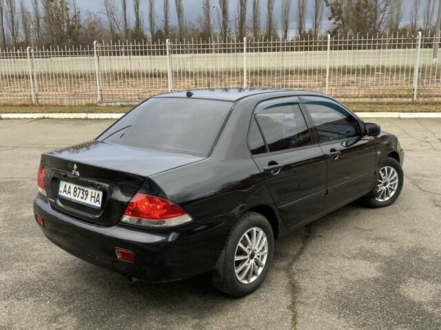 Черный Мицубиси Лансер, объемом двигателя 1.6 л и пробегом 350 тыс. км за 4500 $, фото 3 на Automoto.ua