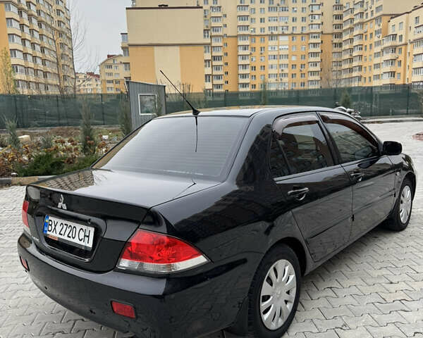 Черный Мицубиси Лансер, объемом двигателя 1.6 л и пробегом 240 тыс. км за 5200 $, фото 8 на Automoto.ua