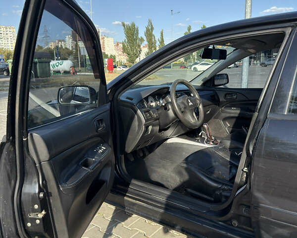 Черный Мицубиси Лансер, объемом двигателя 1.58 л и пробегом 364 тыс. км за 3000 $, фото 6 на Automoto.ua