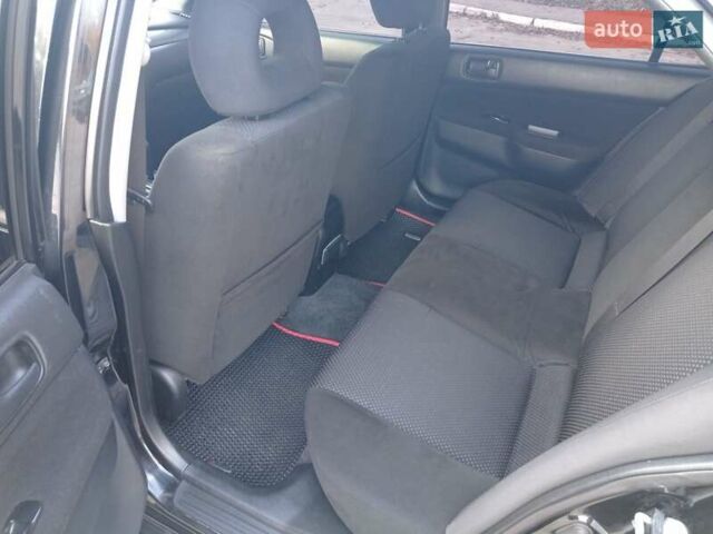 Чорний Міцубісі Lancer, об'ємом двигуна 1.58 л та пробігом 286 тис. км за 4950 $, фото 10 на Automoto.ua