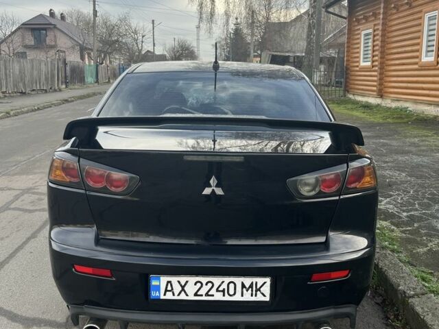 Черный Мицубиси Лансер, объемом двигателя 2 л и пробегом 270 тыс. км за 5600 $, фото 7 на Automoto.ua