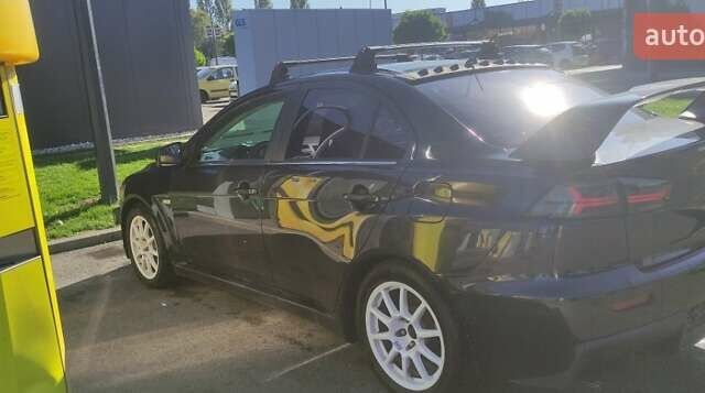 Чорний Міцубісі Lancer, об'ємом двигуна 2 л та пробігом 134 тис. км за 29034 $, фото 9 на Automoto.ua